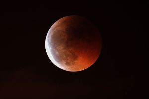 A lunar eclipse. The moon turns red.  Photo credit: Juan lacruz